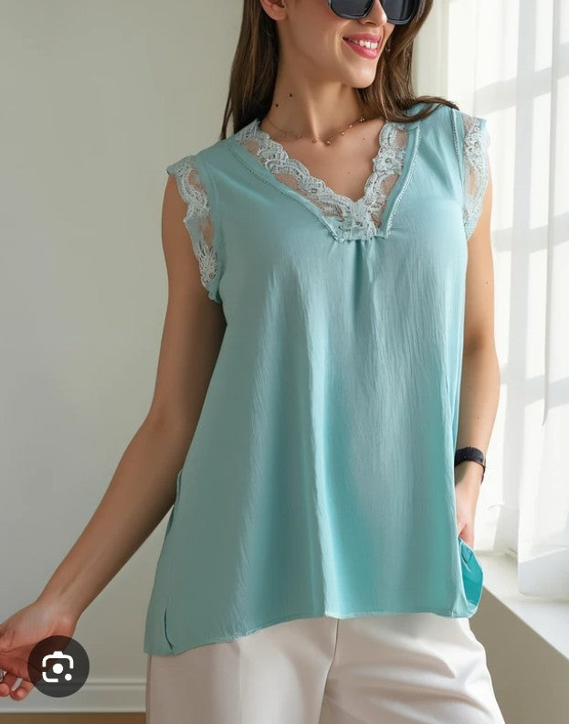Women’s lace short sleeve blouse in light blue with V-neck lace trim and relaxed fit