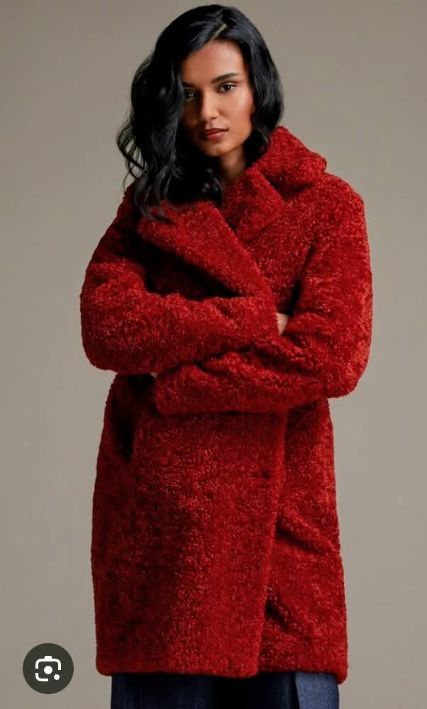 Red shearling coat with hood, long sleeves, front pockets, full-length design
