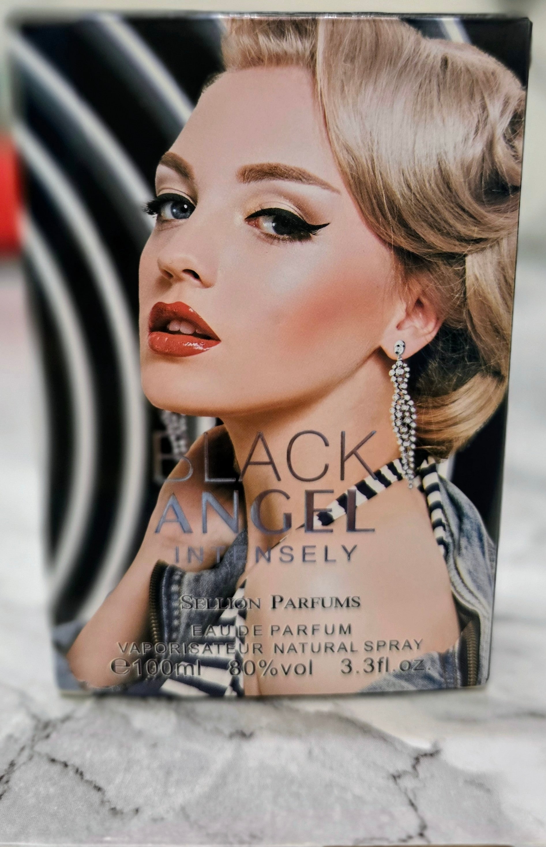 Women's perfume box with Black Angel graphic and 'Intensely' text