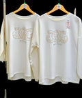 White embellished sweatshirt with multicolor sequined “LOVE” applique on chest