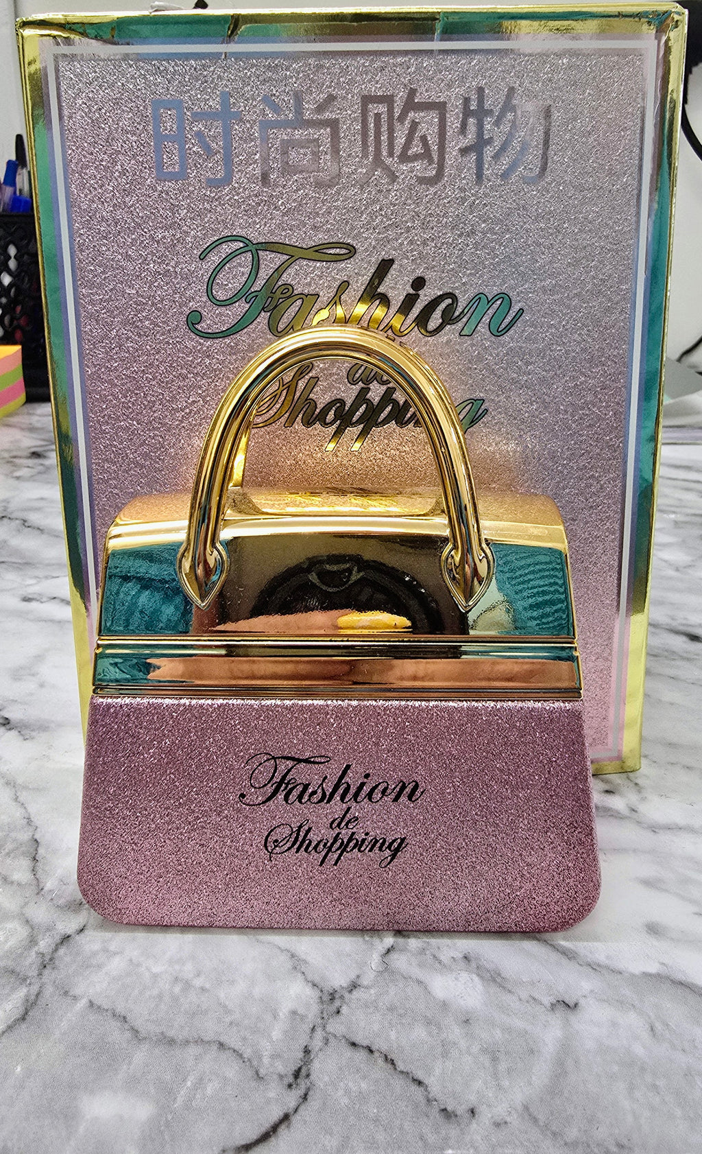 Women's perfume handbag box with gold handle, purple glitter front and Fashion Shopping logo