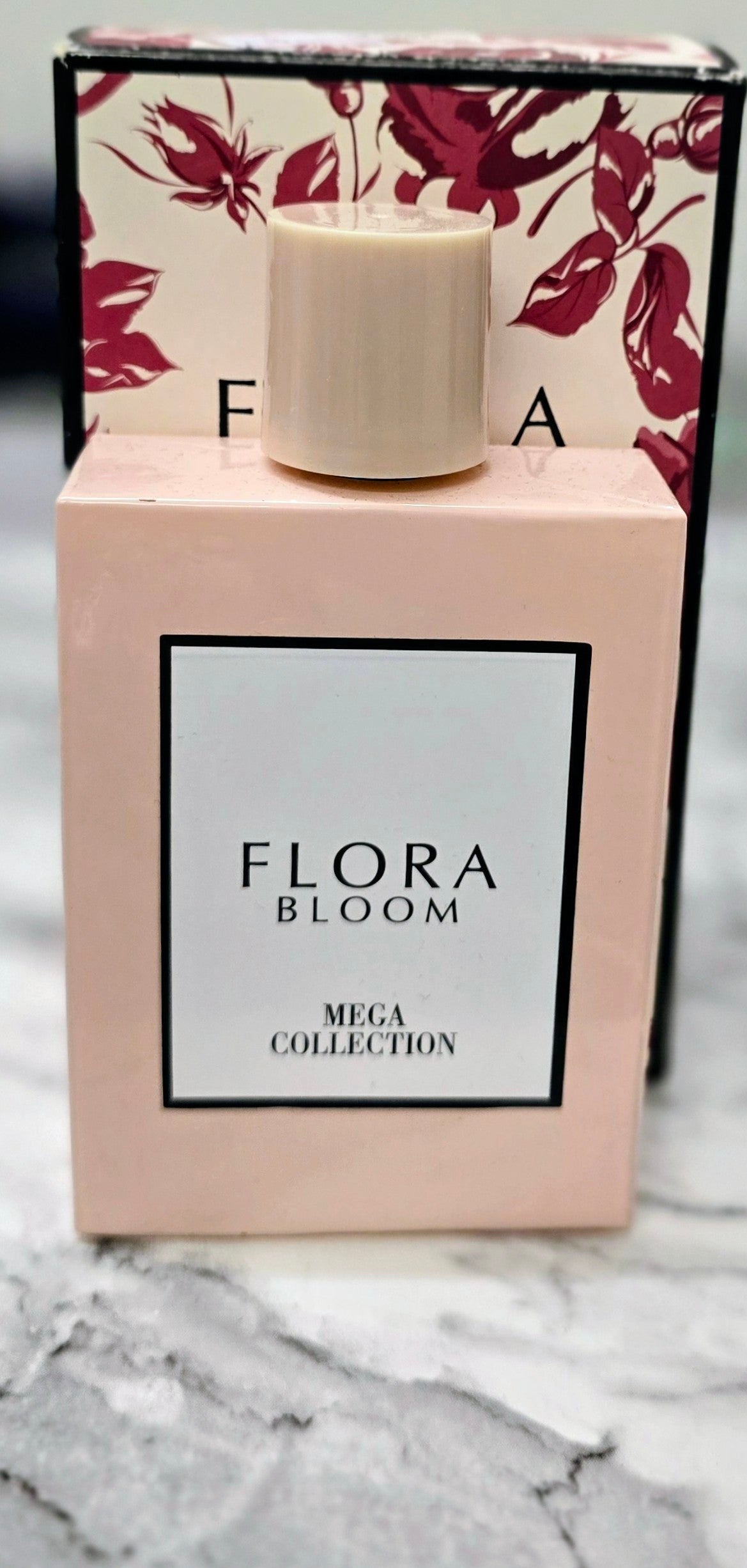 Flora Bloom perfume carton with white cap and burgundy floral background, Mega Collection