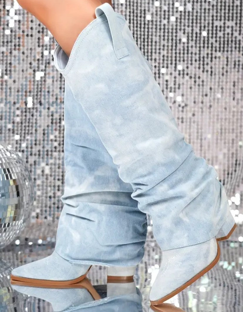 Light blue bootcut jeans with front yoke seam and straight-to-flare leg shape.