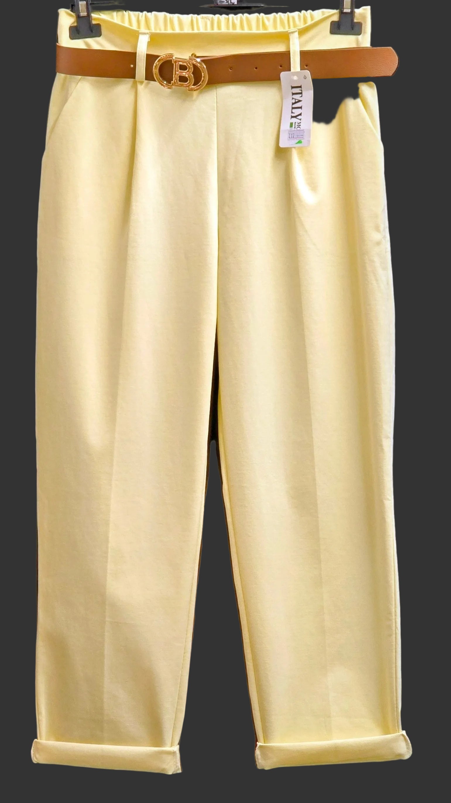Yellow women's trousers with tan summer belt and gold buckle at waistband
