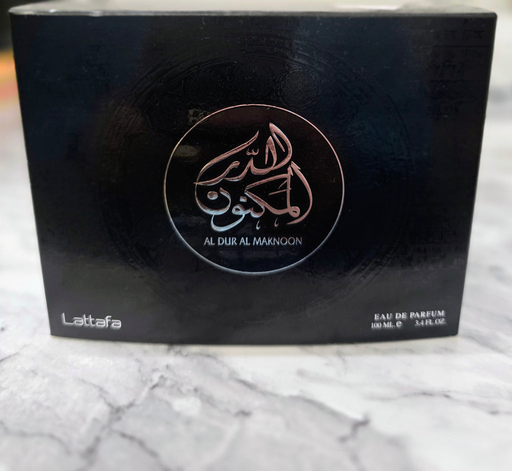 Men's eau de parfum box by Lattafa, dark with gold logo and 100 ml text