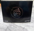 Men's eau de parfum box by Lattafa, dark with gold logo and 100 ml text