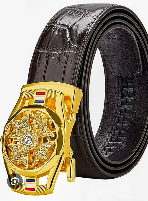 Dark leather men's belt with gold buckle and jeweled center emblem, decorative inlays