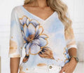 Light blue embellished V-neck sweater with floral appliqué, 3/4 sleeves