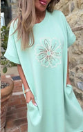 Women’s mint tunic dress with embroidered floral embellishment at chest
