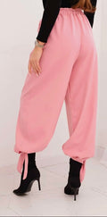 Women's tie-hem trousers in pink, elastic waistband and tied hem cuffs