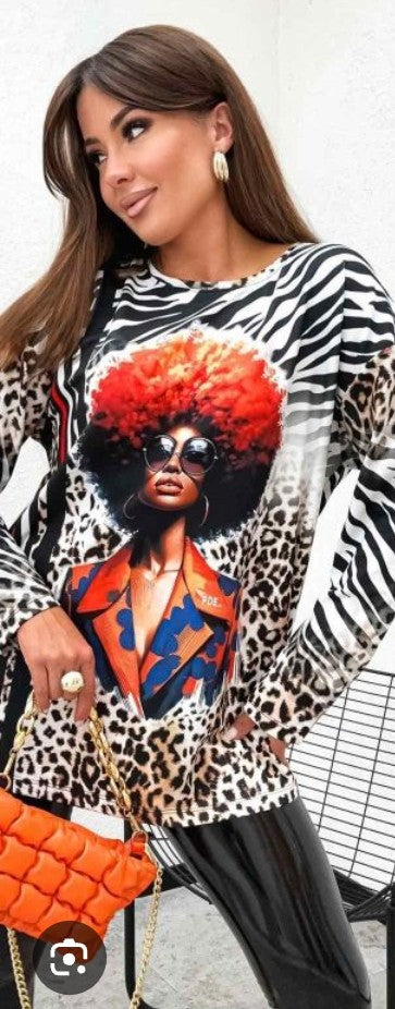 Printed blouse with black-and-white zebra/leopard print and colorful portrait front