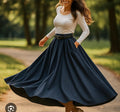 Navy pleated midi skirt with wide waist belt