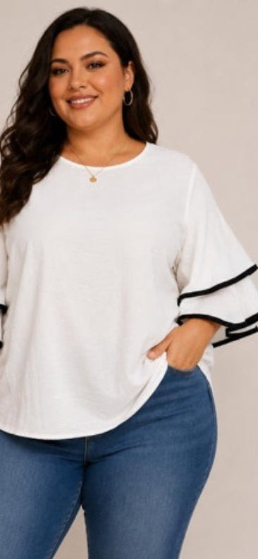 Women's ruffle blouse in white with black contrast trim at sleeves, relaxed fit