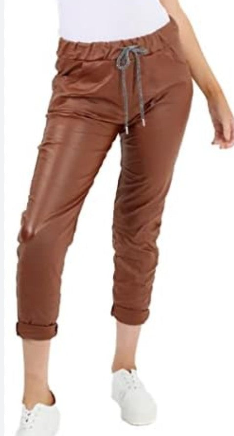 Brown faux leather trousers with ruched drawstring waist and cuffed hems
