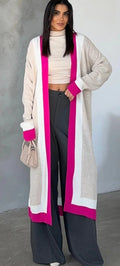 Long beige cardigan with open front, magenta trim and side pockets.