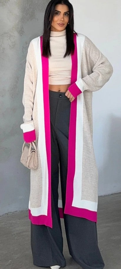 Long beige cardigan with open front, magenta trim and side pockets.