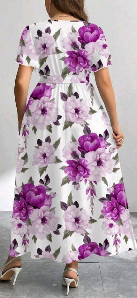 Women’s belted flowy dress, back view, white with purple floral print, short sleeves