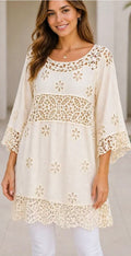 Off-white three-quarter sleeve tunic with floral lace trim and cutwork panels