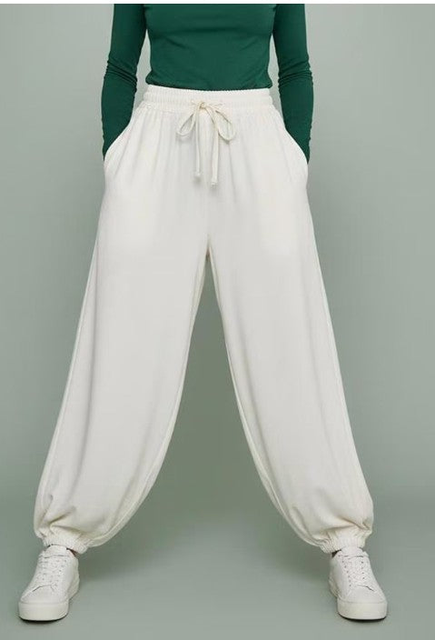 White balloon trousers for women with elastic cuffs and drawstring waistband