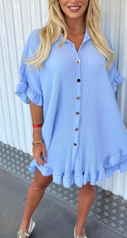 Light blue tunic with button front, ruffled sleeves, and tiered hem