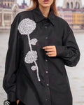 Women's black embellished shirt with long sleeves and silver sequin flower applique