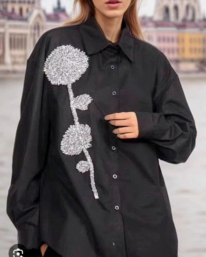 Women's black embellished shirt with long sleeves and silver sequin flower applique