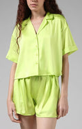 Women's satin pajama set: lime green short-sleeve button shirt and matching shorts