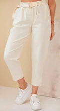 White corduroy trousers with belt, pleated front, cuffed hems