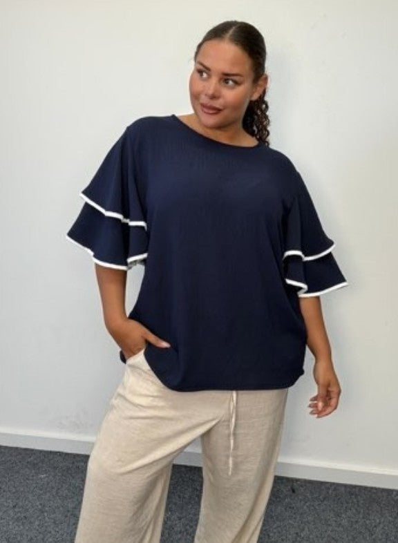 Plus size blouse with short bell sleeves and contrast white trim, dark navy
