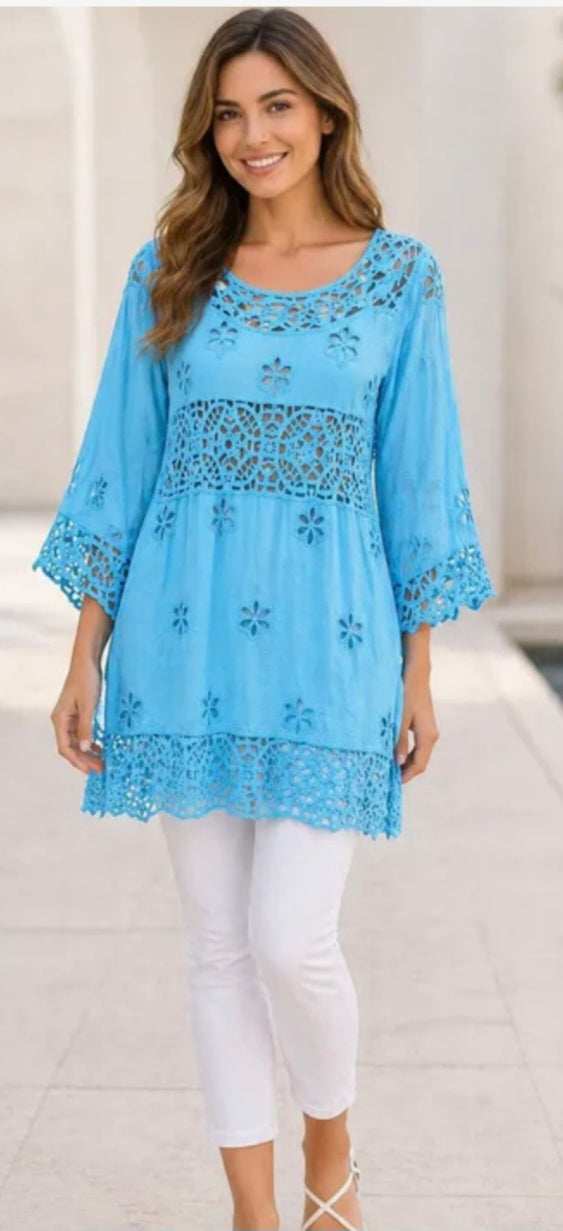 Women's tunic in light blue with lace-style embroidery and tiered hem, 3/4 sleeves