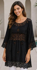 Black embroidered three-quarter sleeve tunic with round neckline and floral cutwork yoke