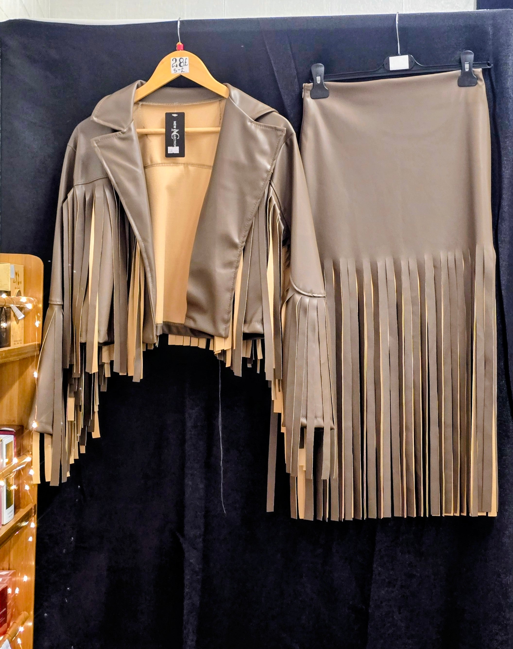 Beige faux leather fringe jacket and matching skirt set