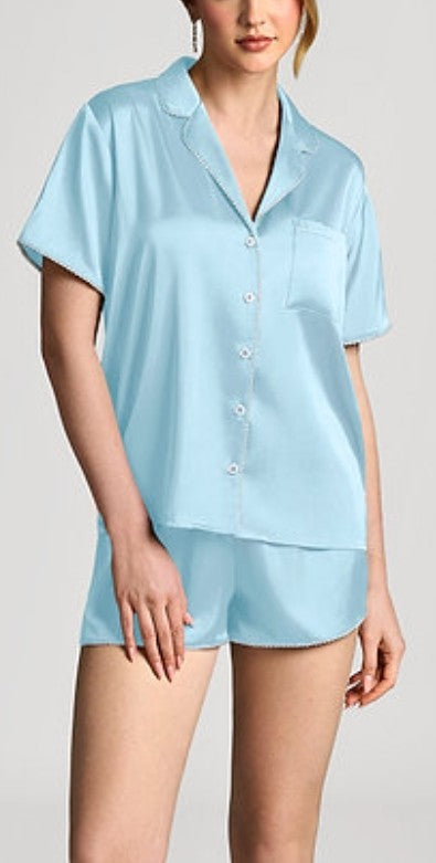 Light blue satin pajama set with short-sleeve button-up top and matching shorts